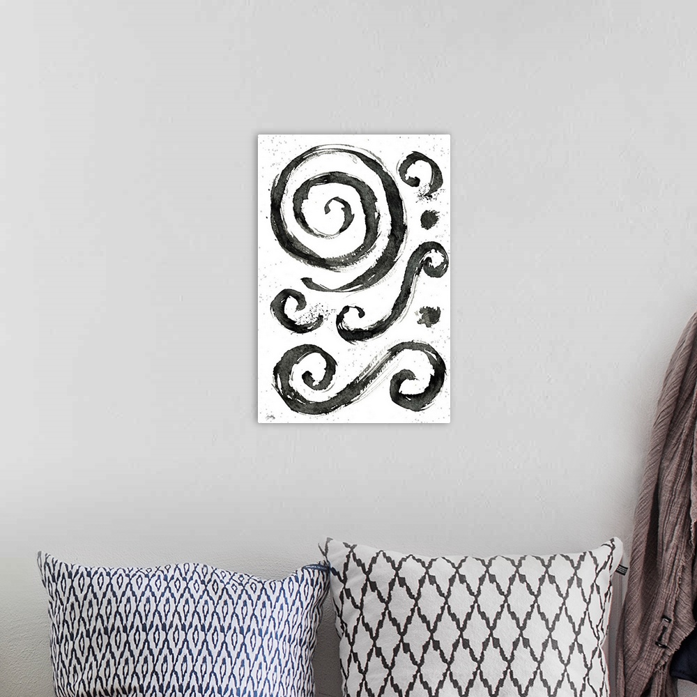 A bohemian room featuring Black and white abstract painting of tribal swirls.