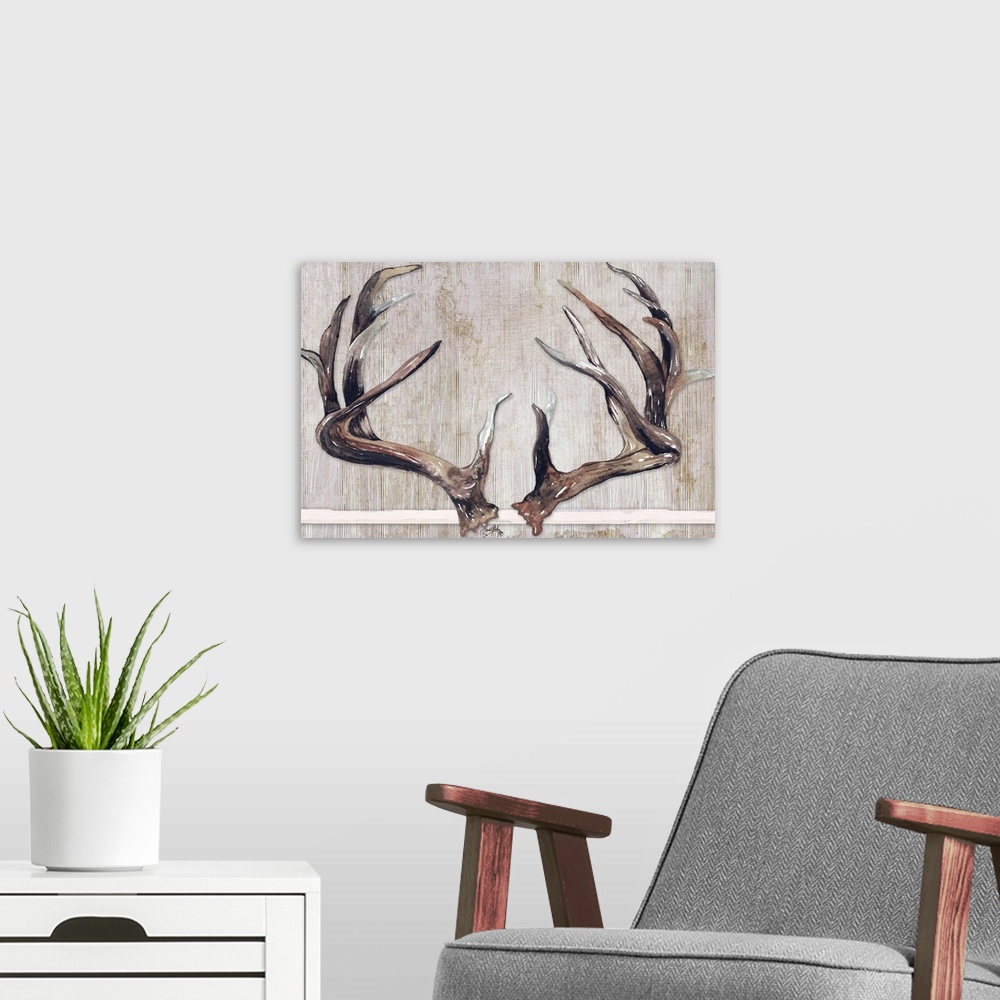 A modern room featuring Painting of two sets of deer antlers with a wooden background.