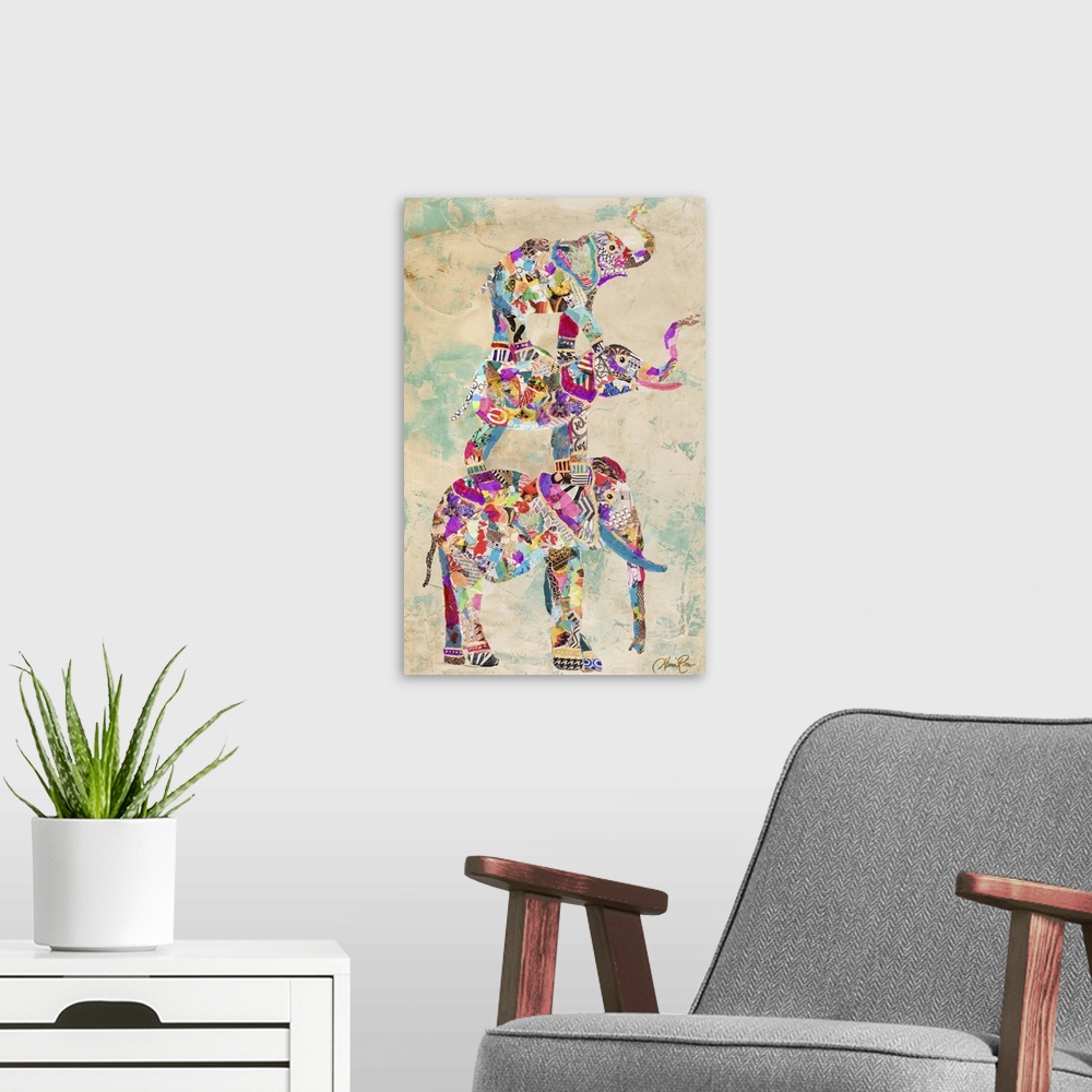 A modern room featuring Painting of three colorful different sized elephants standing on top of each other.