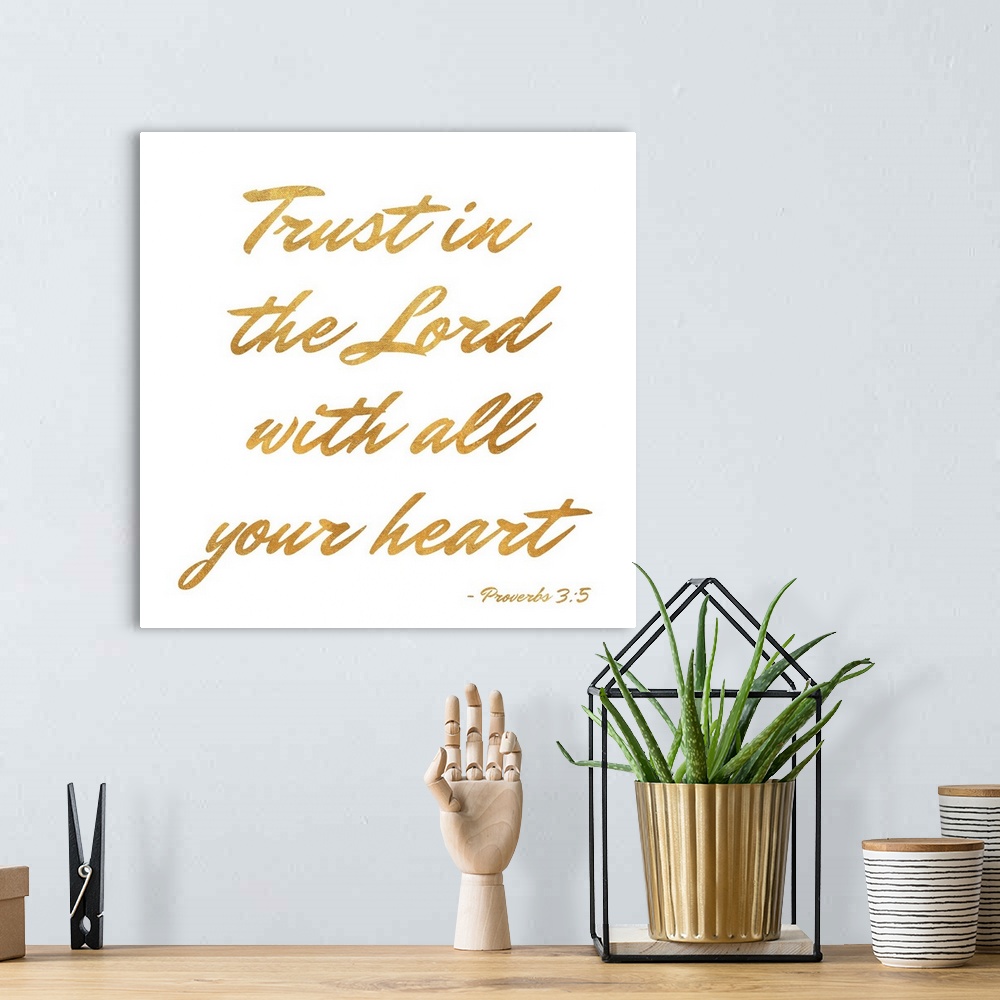 A bohemian room featuring "Trust in the Lord With All Your Heart" Proverbs 3:5 written in gold on a solid white background.