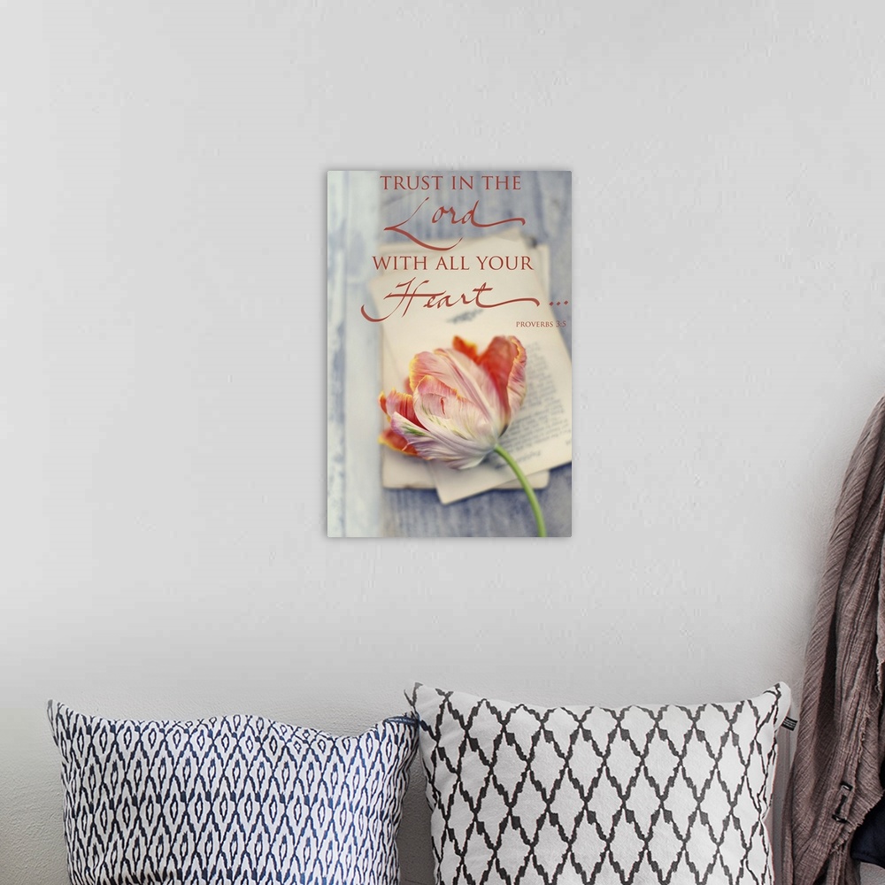 A bohemian room featuring Photograph of a flower laying on top of sheets of typed paper with the bible verse "Trust in the ...