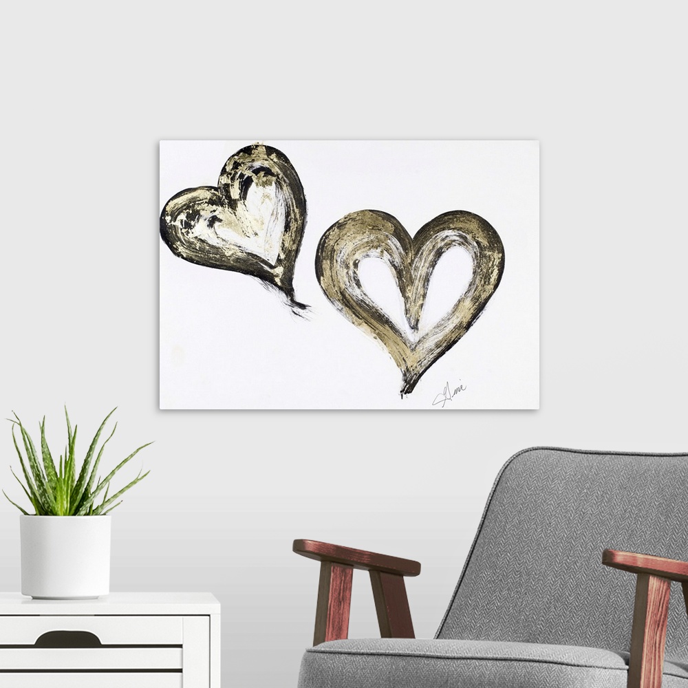 A modern room featuring A painting of two black and gold hearts.