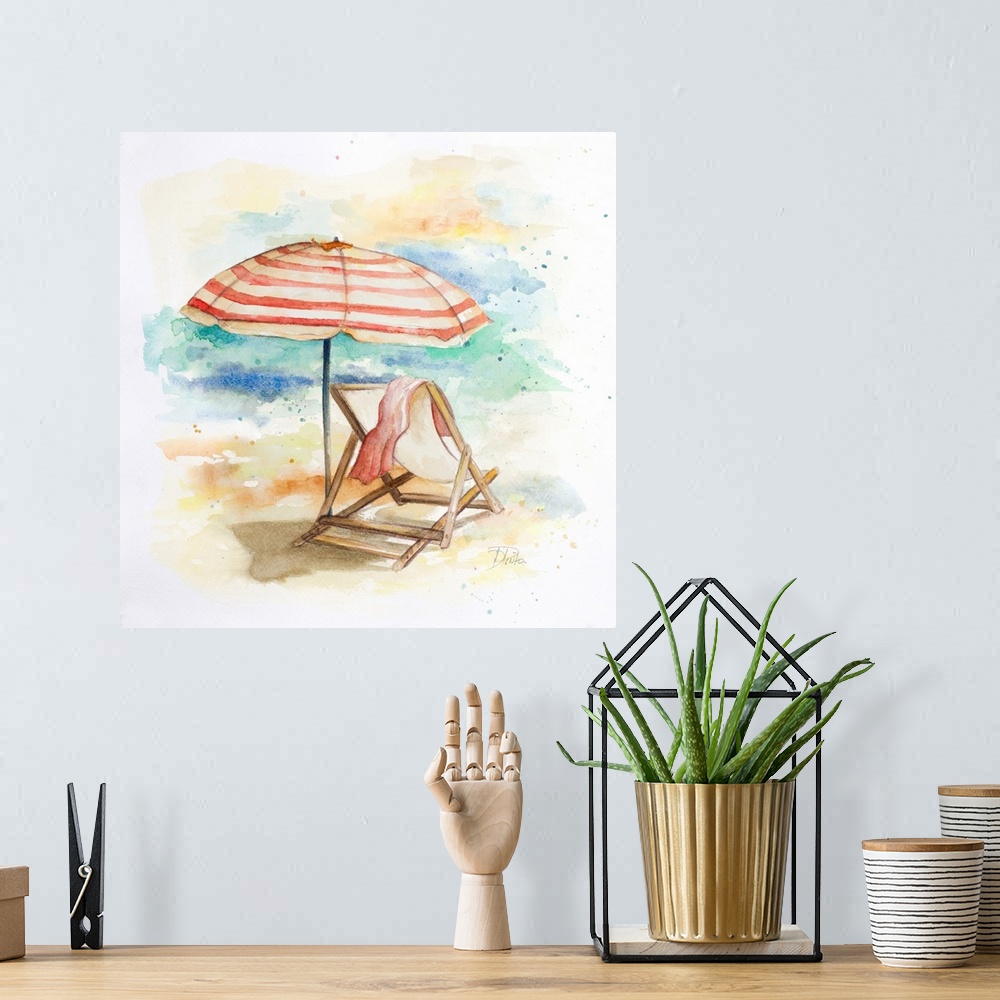 A bohemian room featuring Watercolor painting of a beach chair and a striped umbrella in the sand.
