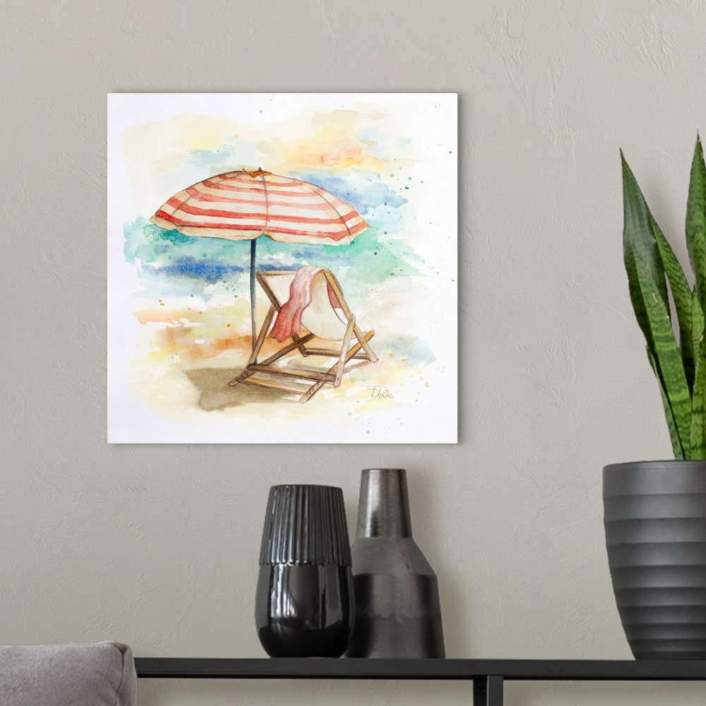 A modern room featuring Watercolor painting of a beach chair and a striped umbrella in the sand.
