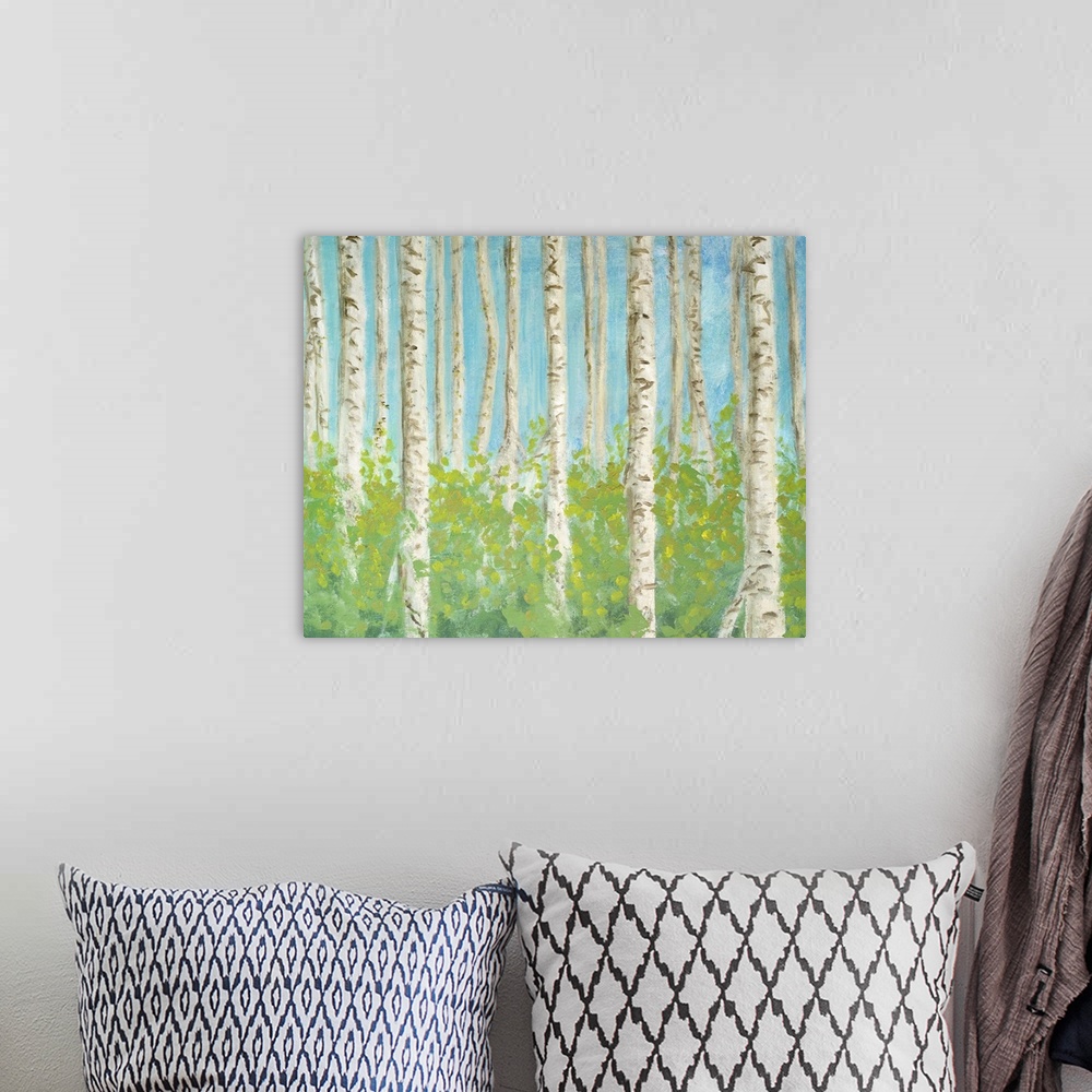 A bohemian room featuring Decorative artwork of a forest of birch trees.