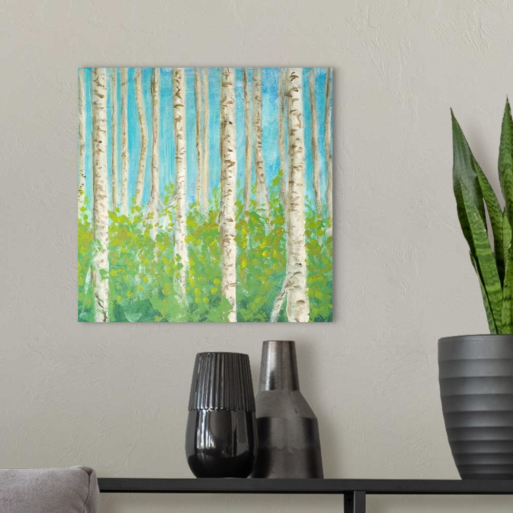 A modern room featuring Decorative artwork of a forest of birch trees.