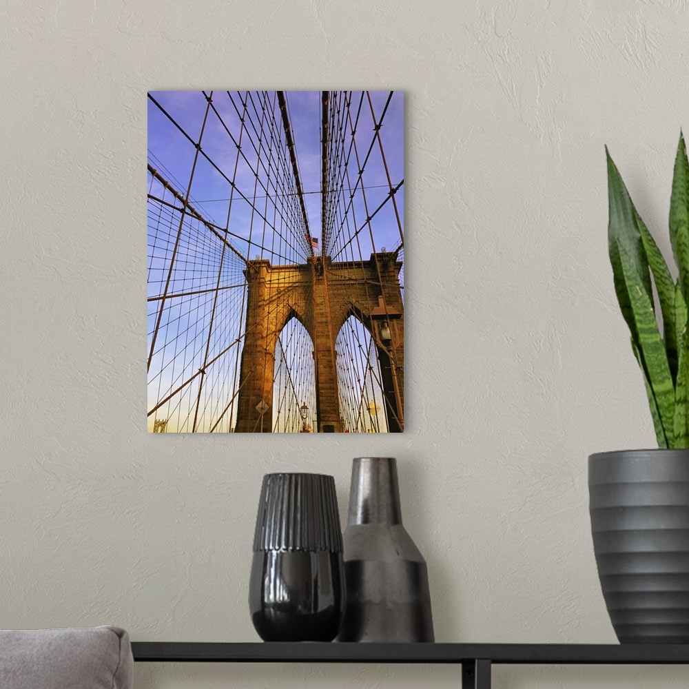 A modern room featuring View of the Brooklyn Bridge with criss-crossing suspension cables.