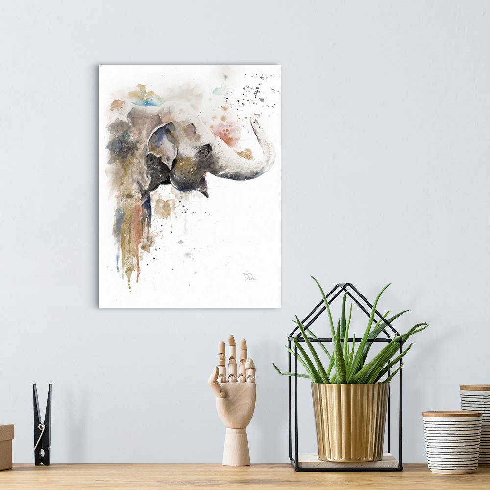 A bohemian room featuring Watercolor painting of an elephant embellished with gold and paint splatters.