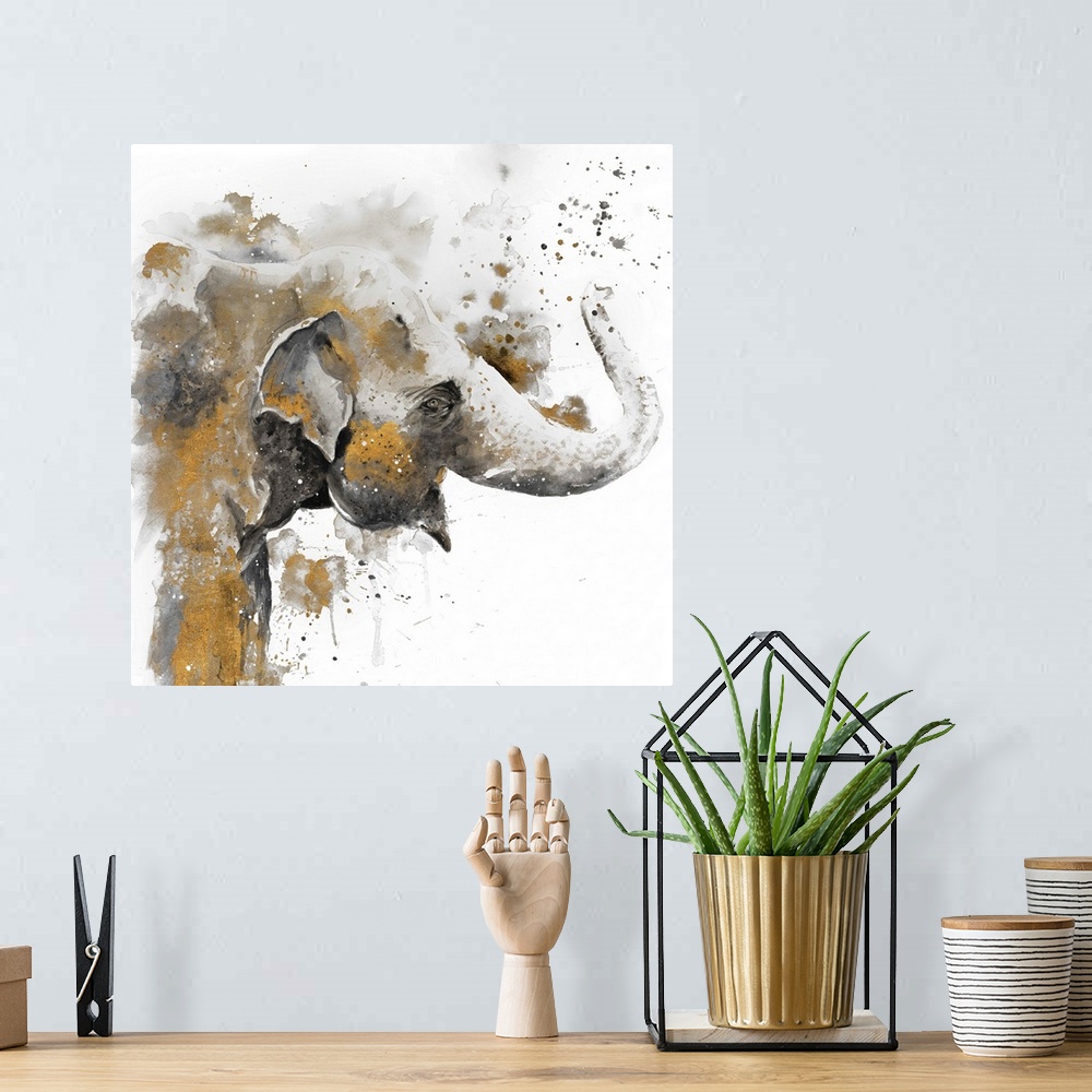 A bohemian room featuring Watercolor painting of an elephant embellished with gold and paint splatters.