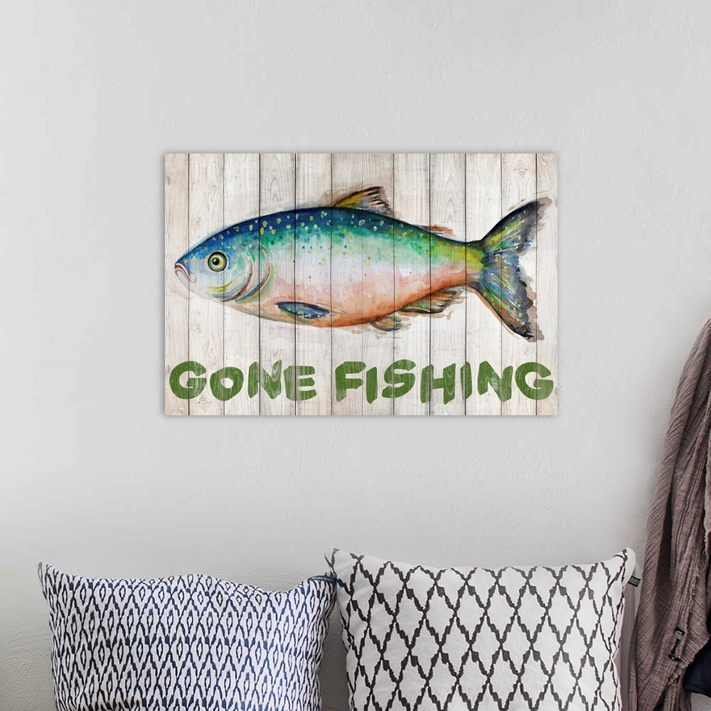 A bohemian room featuring Painting of a fish on wooden boards with "Gone Fishing" written underneath.