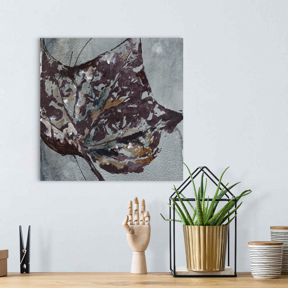 A bohemian room featuring A textured watercolor painting of a leaf.
