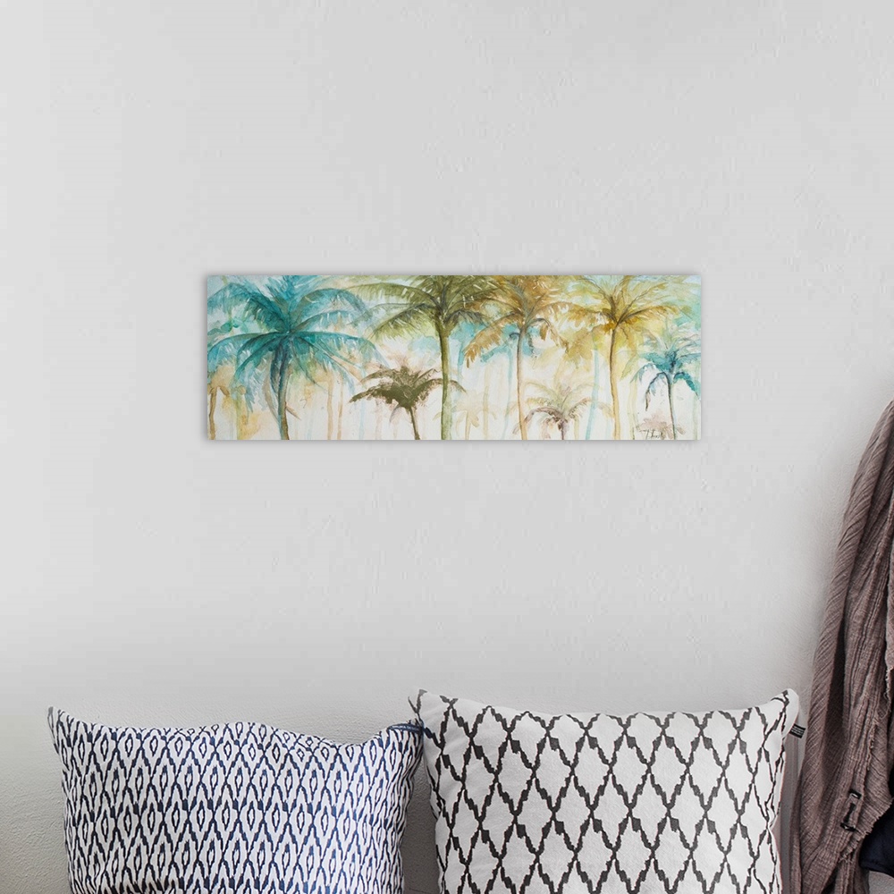 A bohemian room featuring A tropical watercolor painting of tan, blue, green, and yellow palm trees.