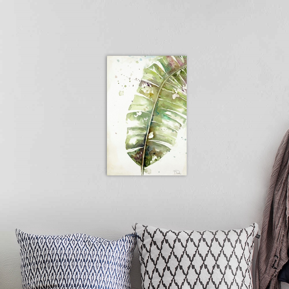 A bohemian room featuring A watercolor painting of a green toned plantain leaf.