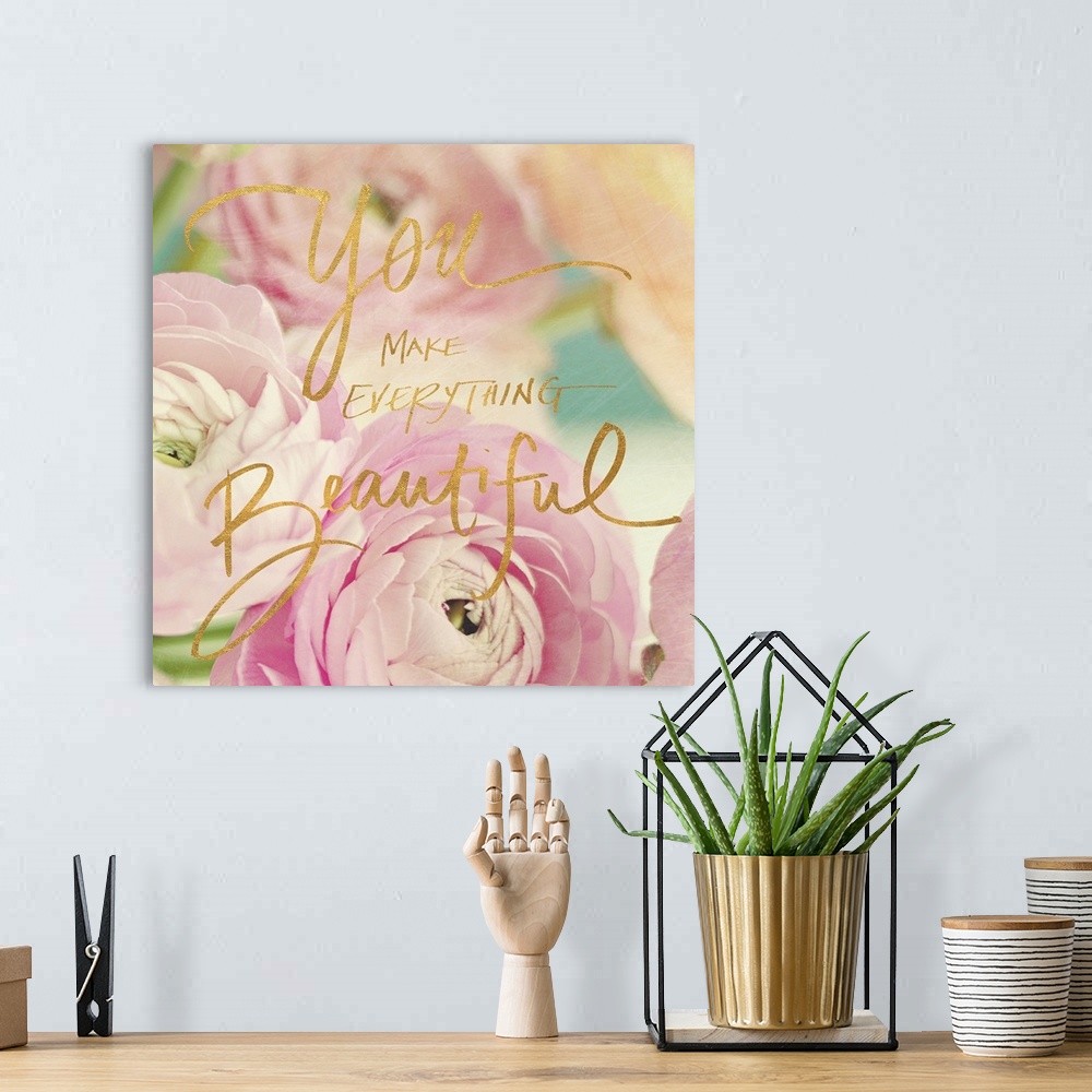 A bohemian room featuring Pastel-toned image of pink flowers with the phrase "You make everything beautiful" hand written o...