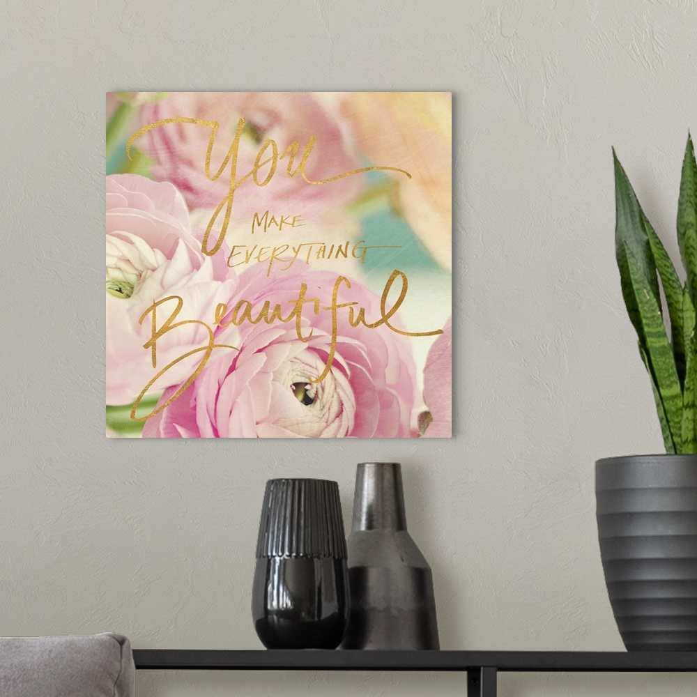A modern room featuring Pastel-toned image of pink flowers with the phrase "You make everything beautiful" hand written o...