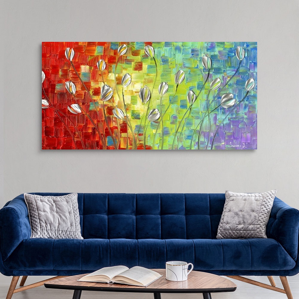 A modern room featuring Large abstract painting with silver long stemmed tulips on a colorful background.