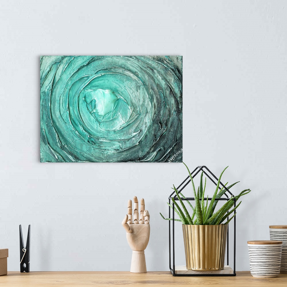 A bohemian room featuring Large abstract painting with thick circular strokes and layers of paint in aqua and silver.