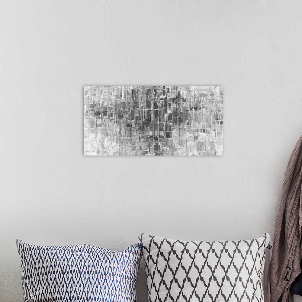 A bohemian room featuring Large abstract painting in gray and white hues with layered brushstrokes.