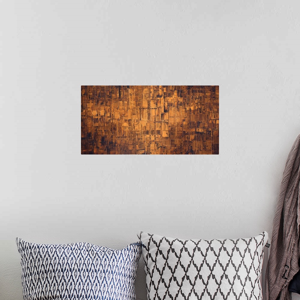A bohemian room featuring Large brown and bronze abstract painting.