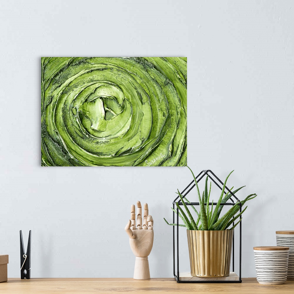 A bohemian room featuring Large abstract painting with thick circular strokes and layers of paint in bright green and silver.