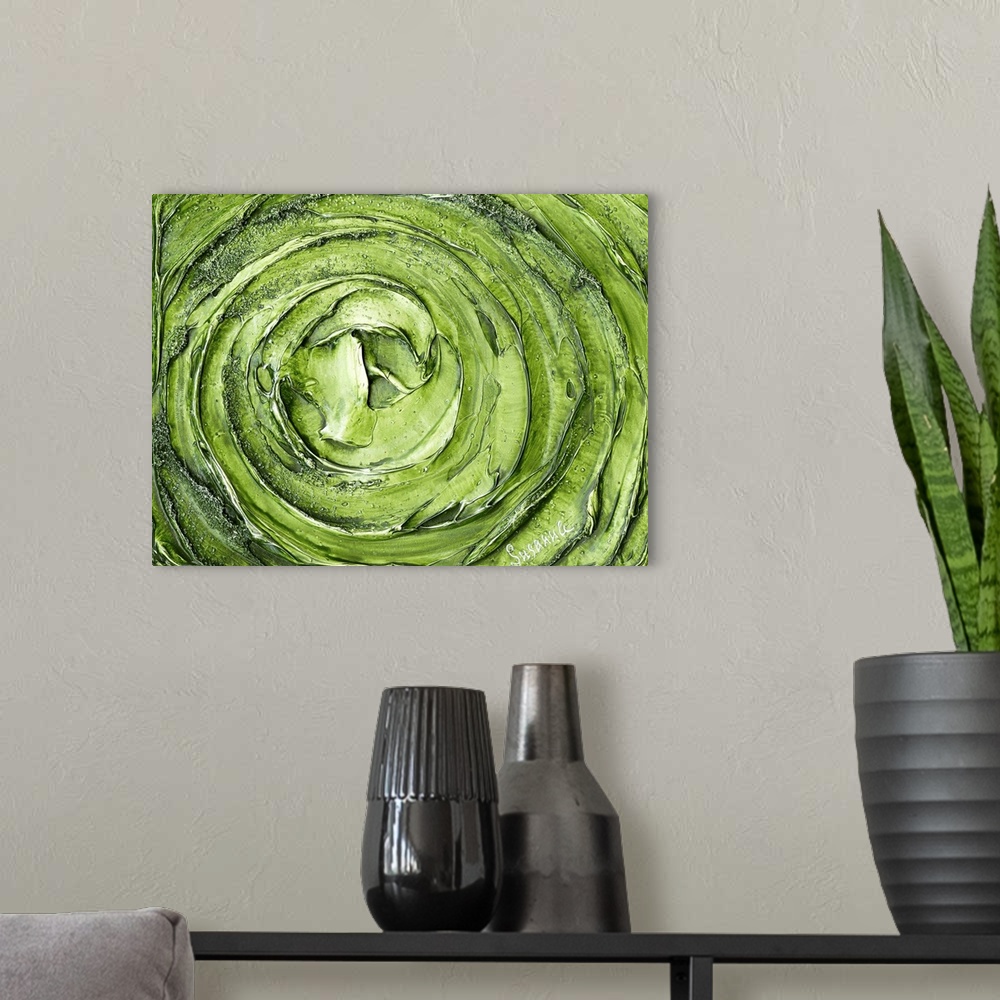 A modern room featuring Large abstract painting with thick circular strokes and layers of paint in bright green and silver.