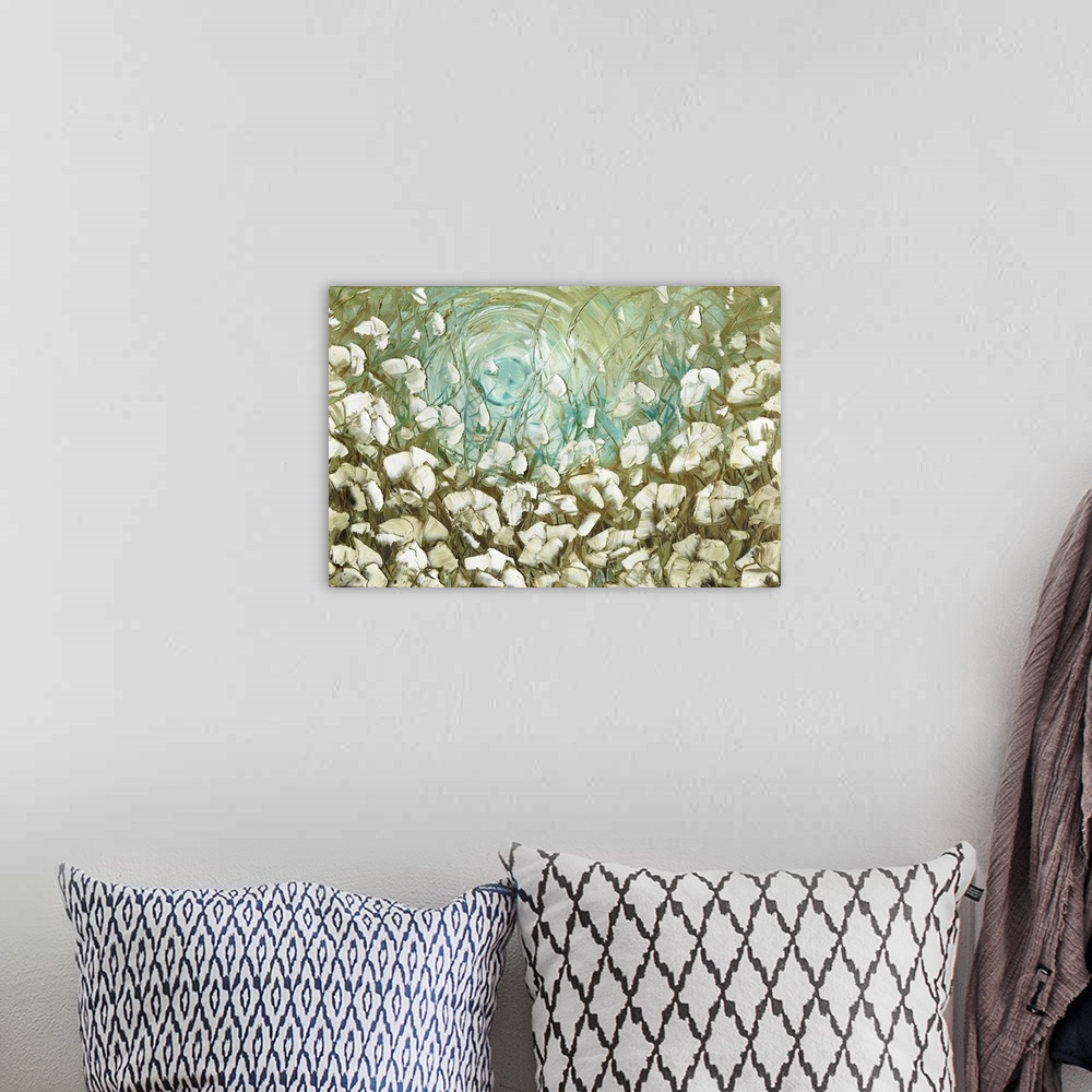 A bohemian room featuring Large abstract painting with white flowers on a green and blue background.