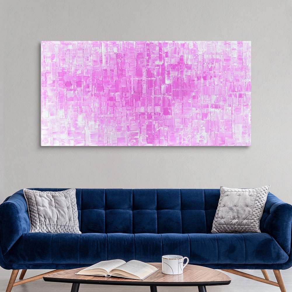 A modern room featuring Large abstract art in shades of pink and white with geometric shapes.