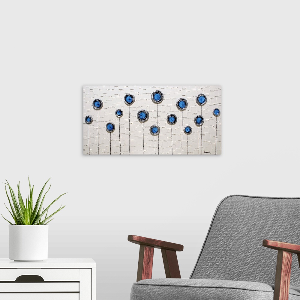 A modern room featuring Wide abstract painting with blue, silver, and black layered circles with thin stems running to th...