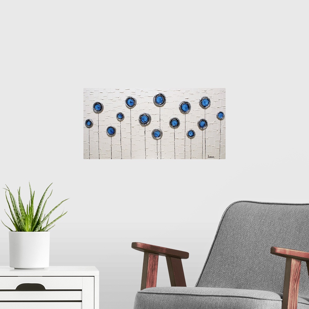 A modern room featuring Wide abstract painting with blue, silver, and black layered circles with thin stems running to th...