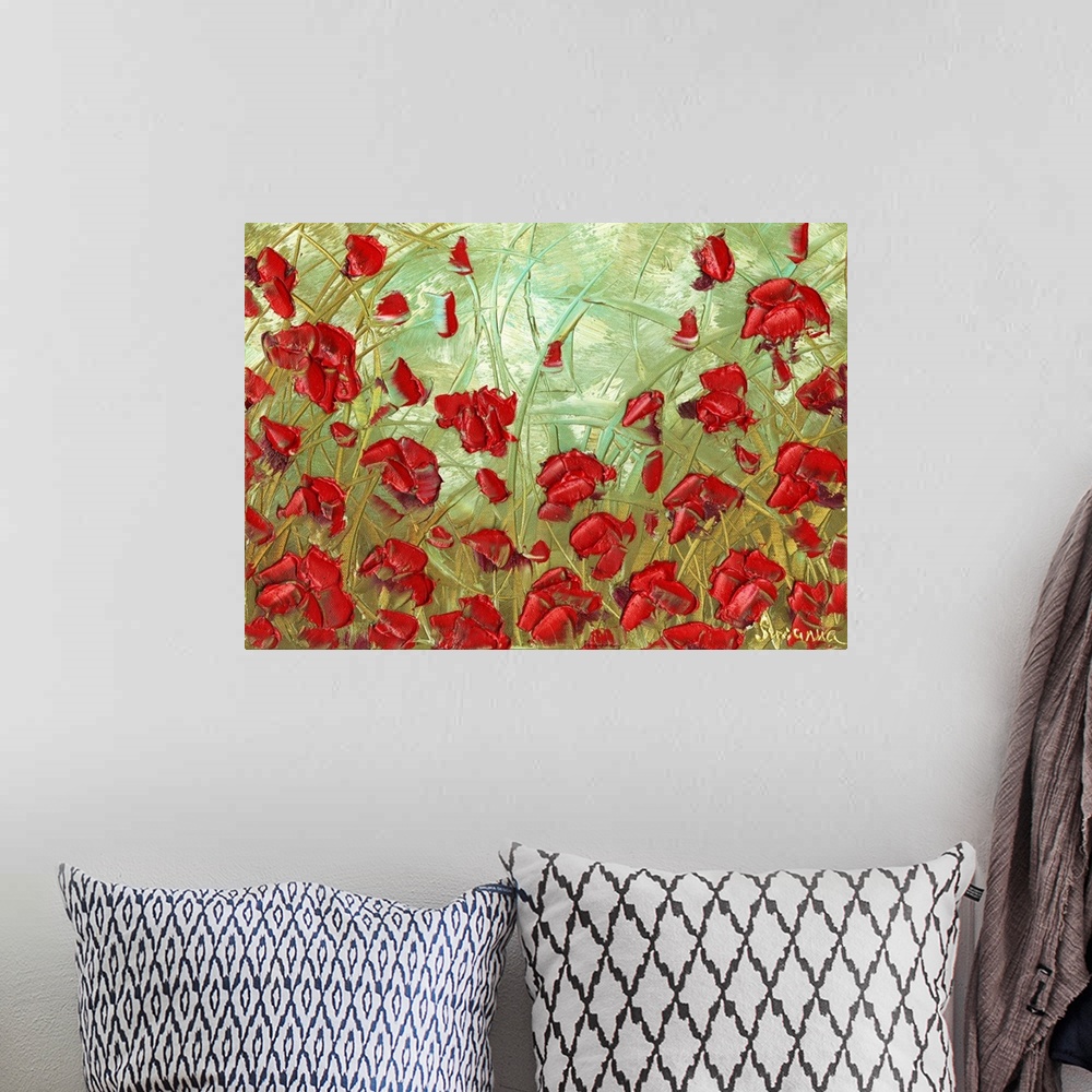 A bohemian room featuring Abstract painting of red poppies in a field with a light green, blue, and yellow background.