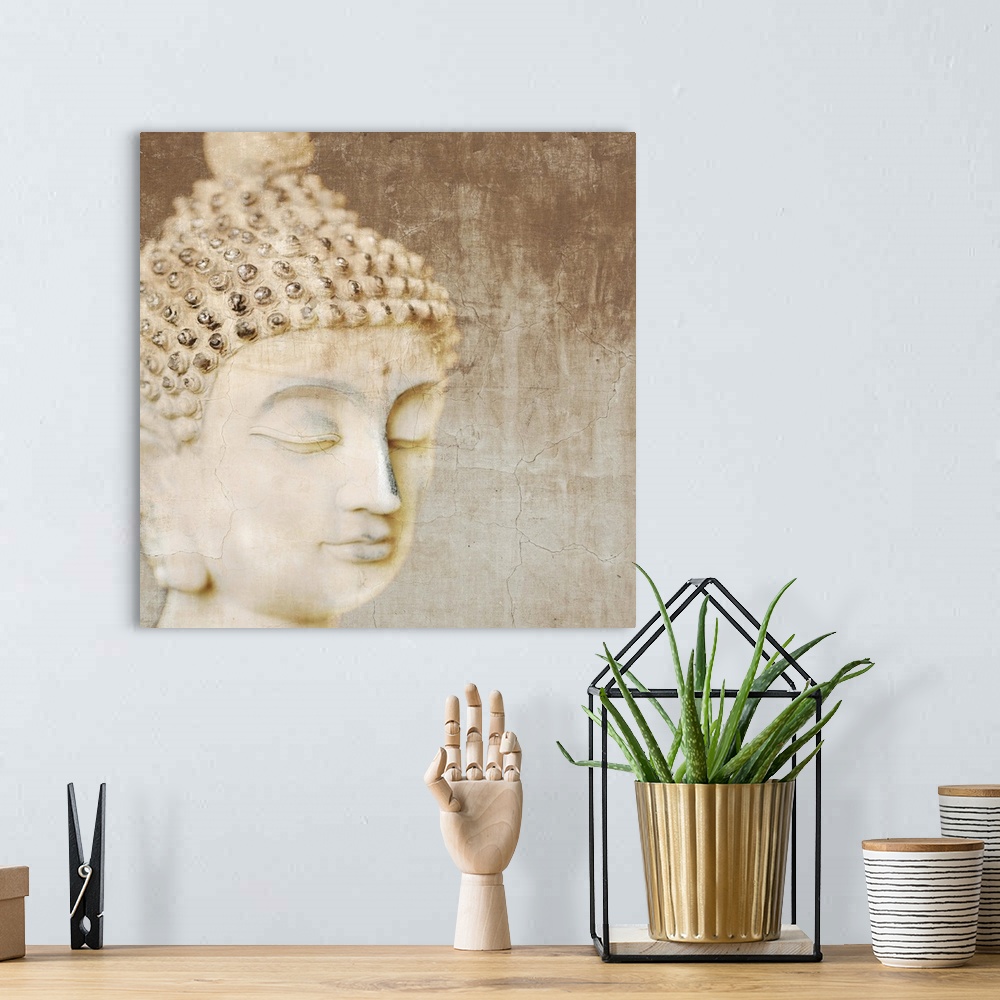 A bohemian room featuring Contemporary photograph of the head of a Buddha statue.
