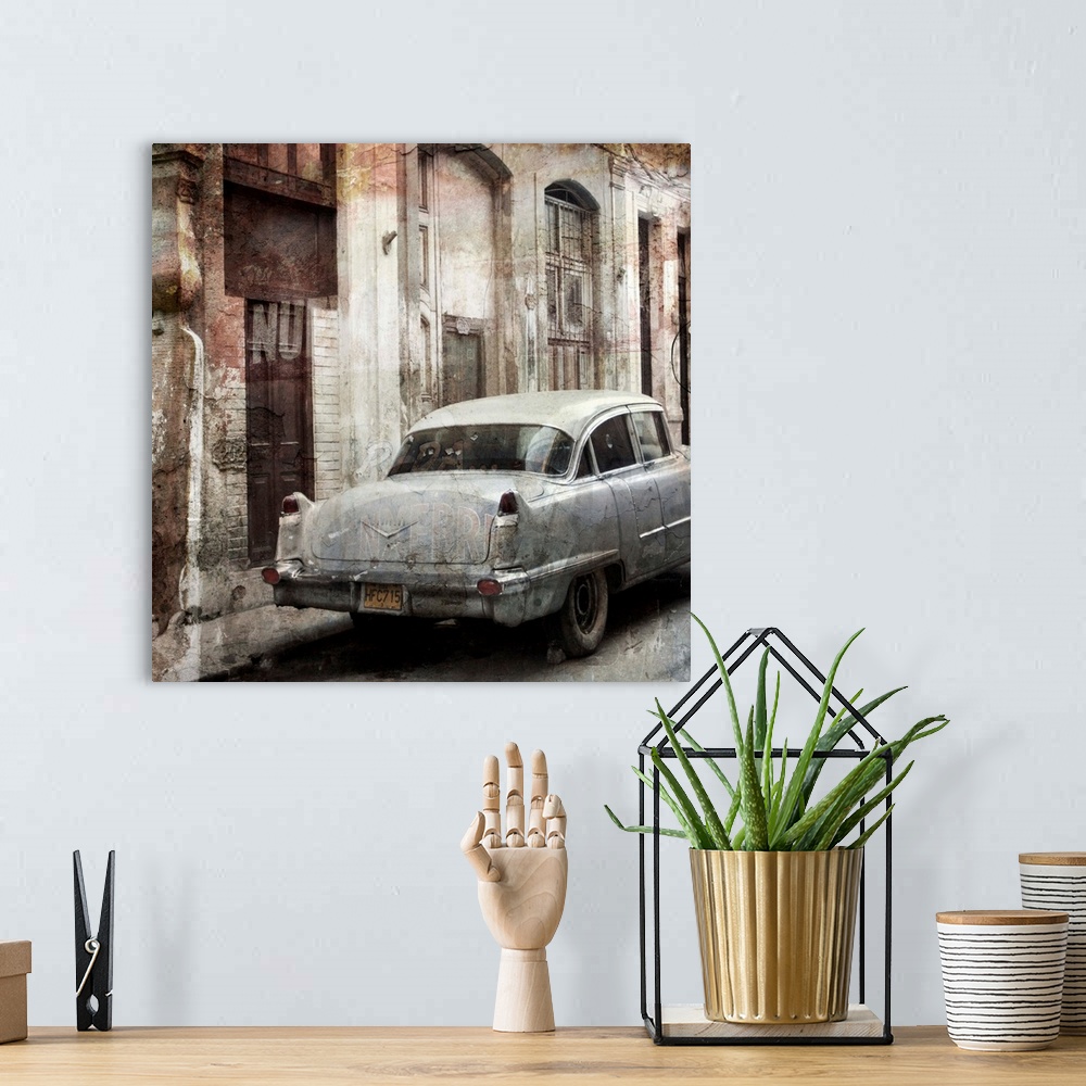 A bohemian room featuring Photograph of a vintage car parked on a street, next to decayed looking buildings.