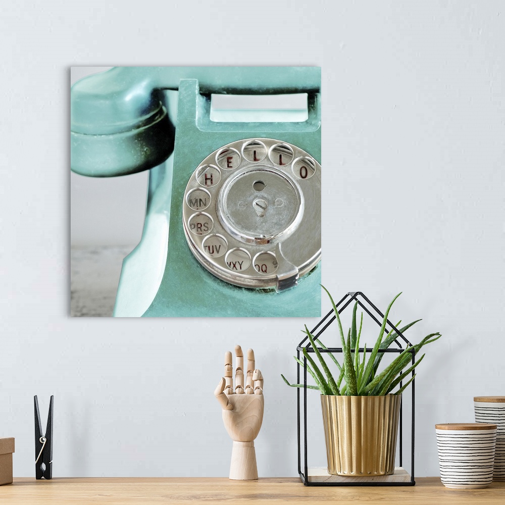 A bohemian room featuring Up-close photograph of dial on old rotary phone.