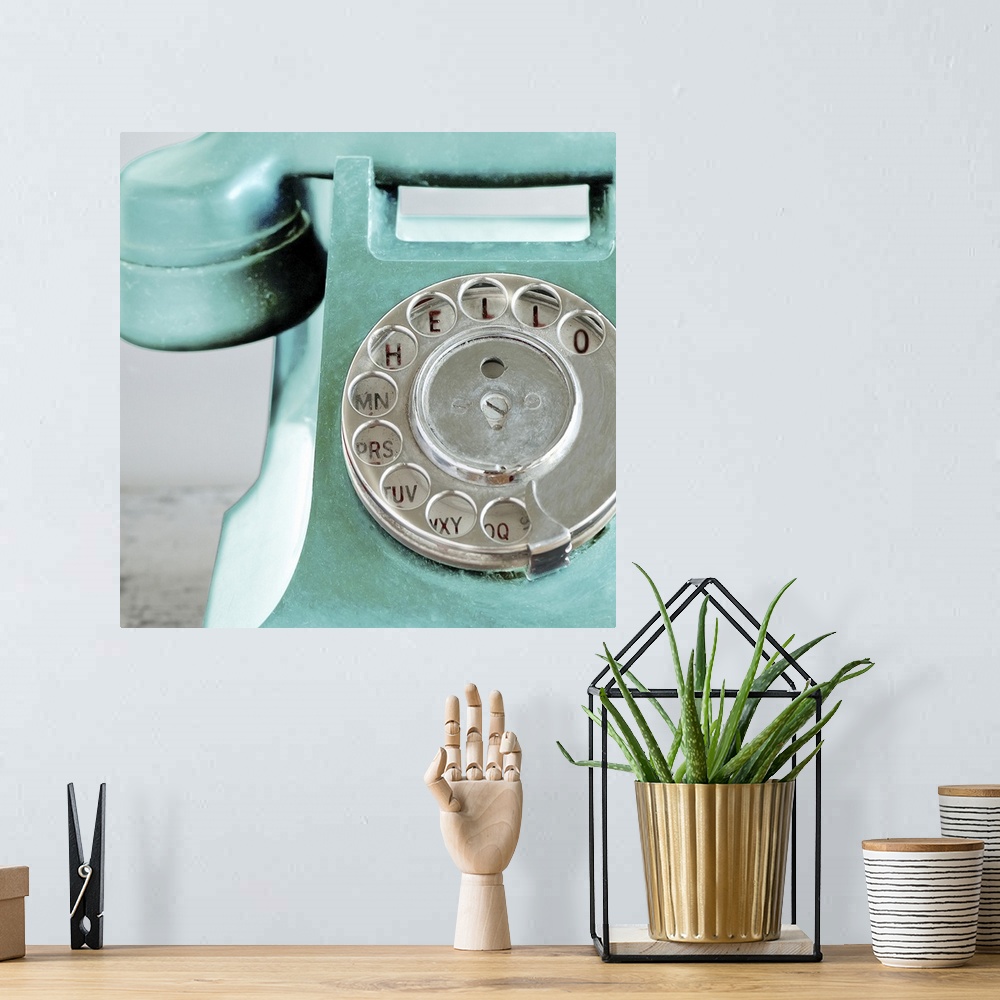 A bohemian room featuring Up-close photograph of dial on old rotary phone.