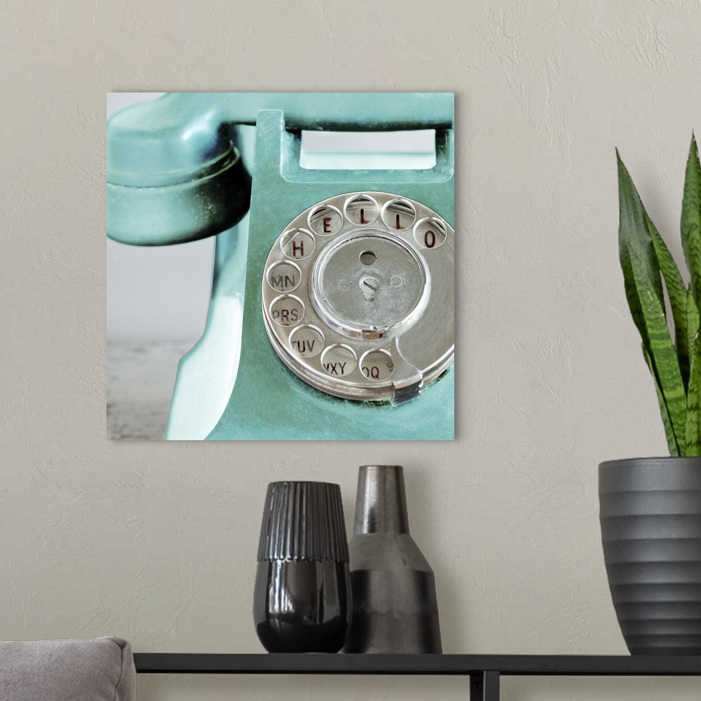 A modern room featuring Up-close photograph of dial on old rotary phone.