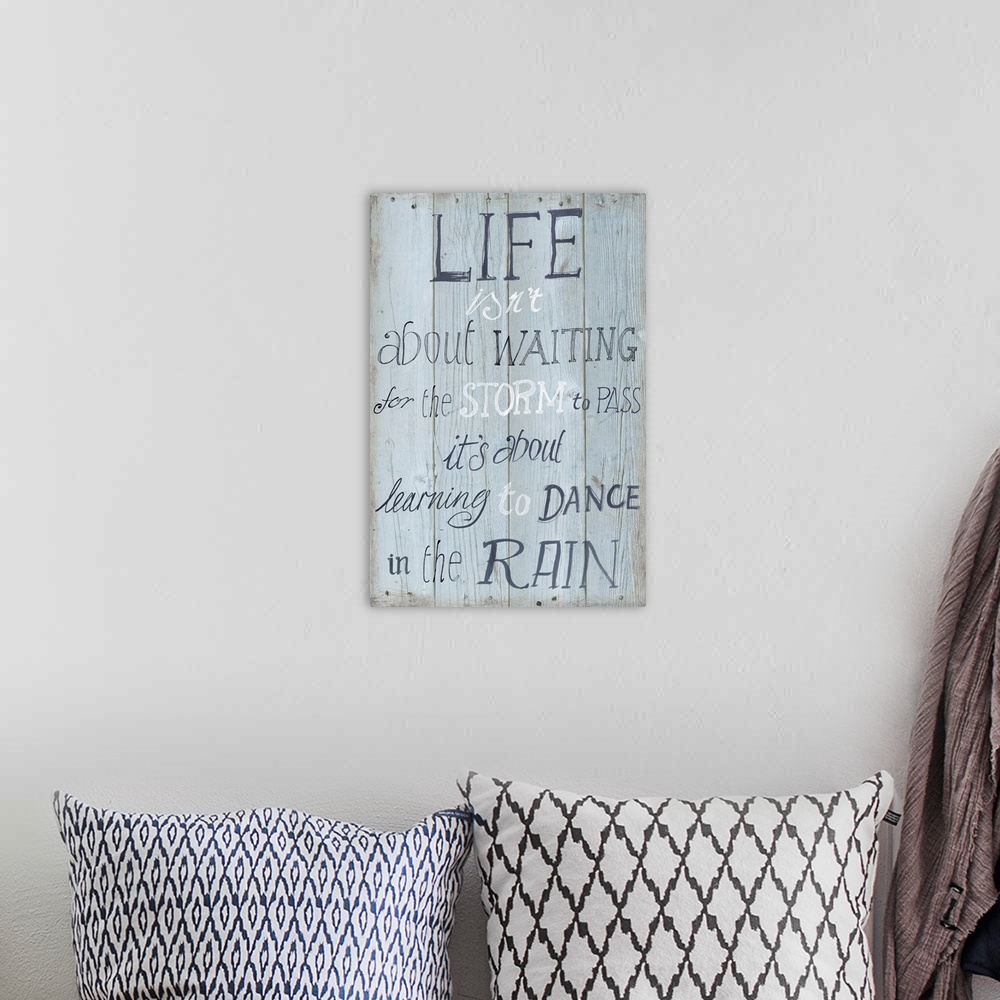 A bohemian room featuring Contemporary artwork of an inspirational quote on a textured wood plank background.