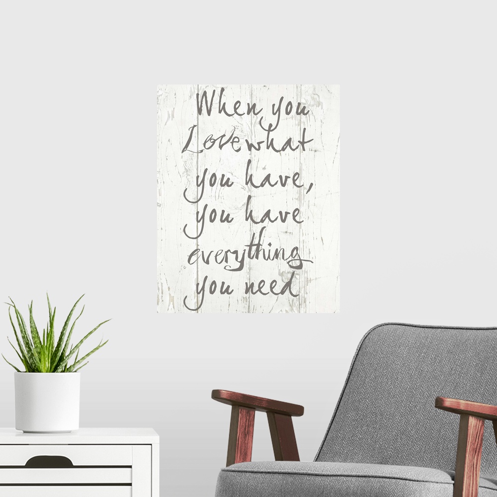 A modern room featuring Contemporary artwork of an inspirational quote on a textured wood plank background.