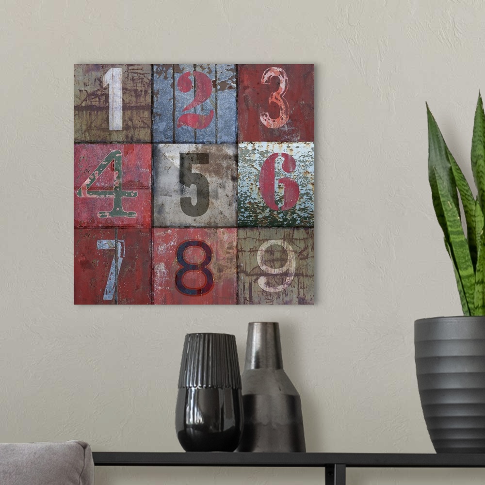 A modern room featuring Contemporary artwork of numbers painted in different styles on a weathered surface.