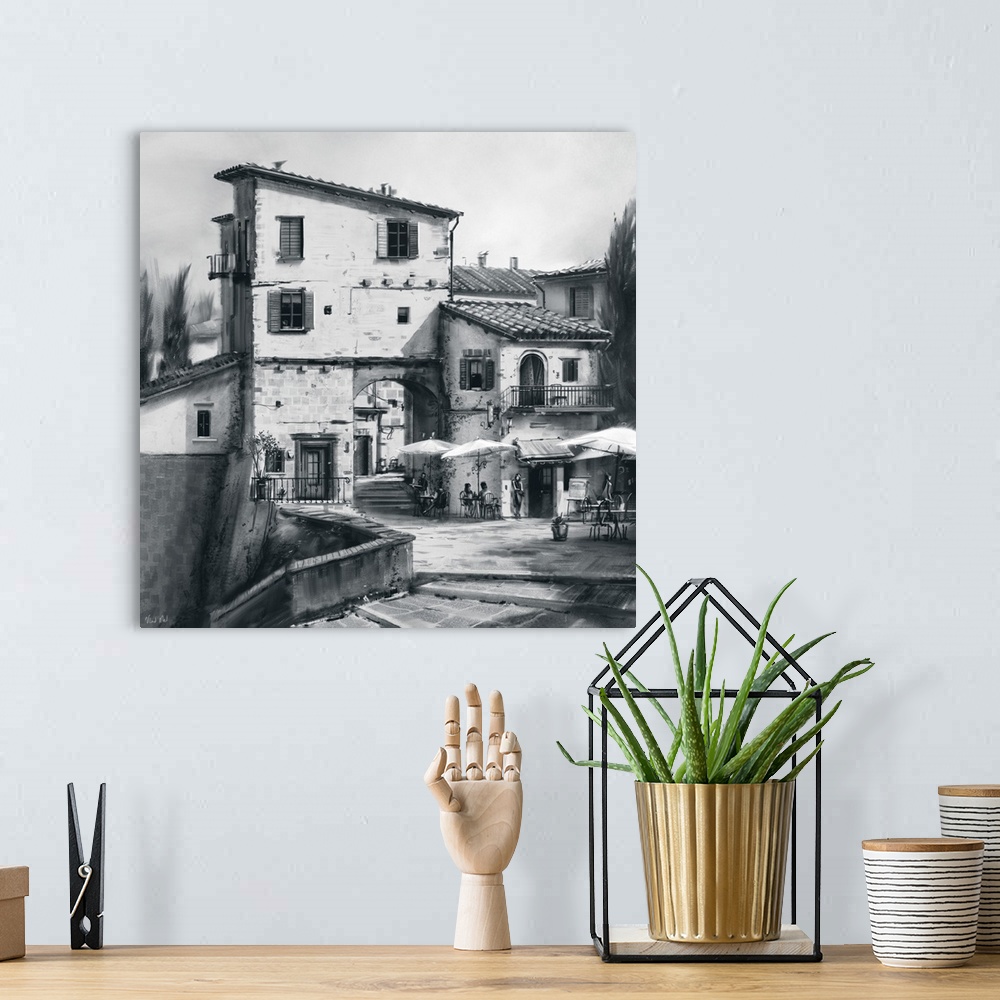 A bohemian room featuring Monochrome painting of a Tuscan street.