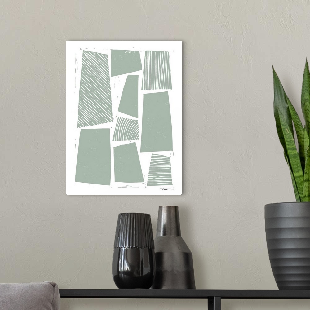 A modern room featuring Abstract shapes with block print wood grain patterns in the color sage.
