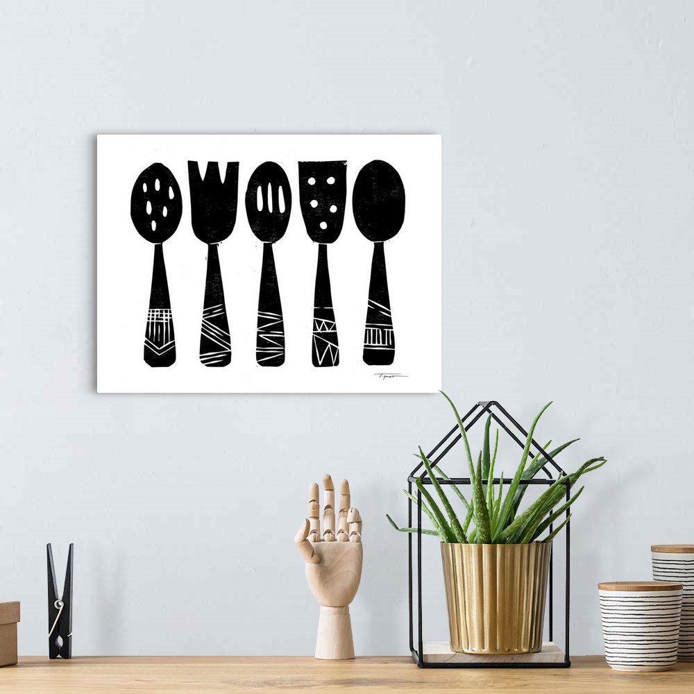 A bohemian room featuring Block printed kitchen utensils in black.