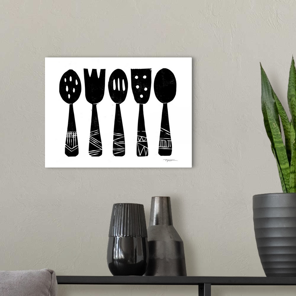 A modern room featuring Block printed kitchen utensils in black.