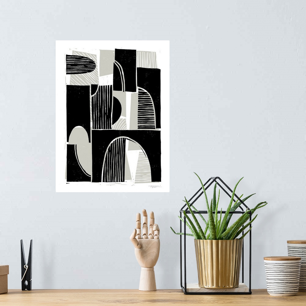 A bohemian room featuring Modern abstract block print with taupe background shapes and black foreground shapes.