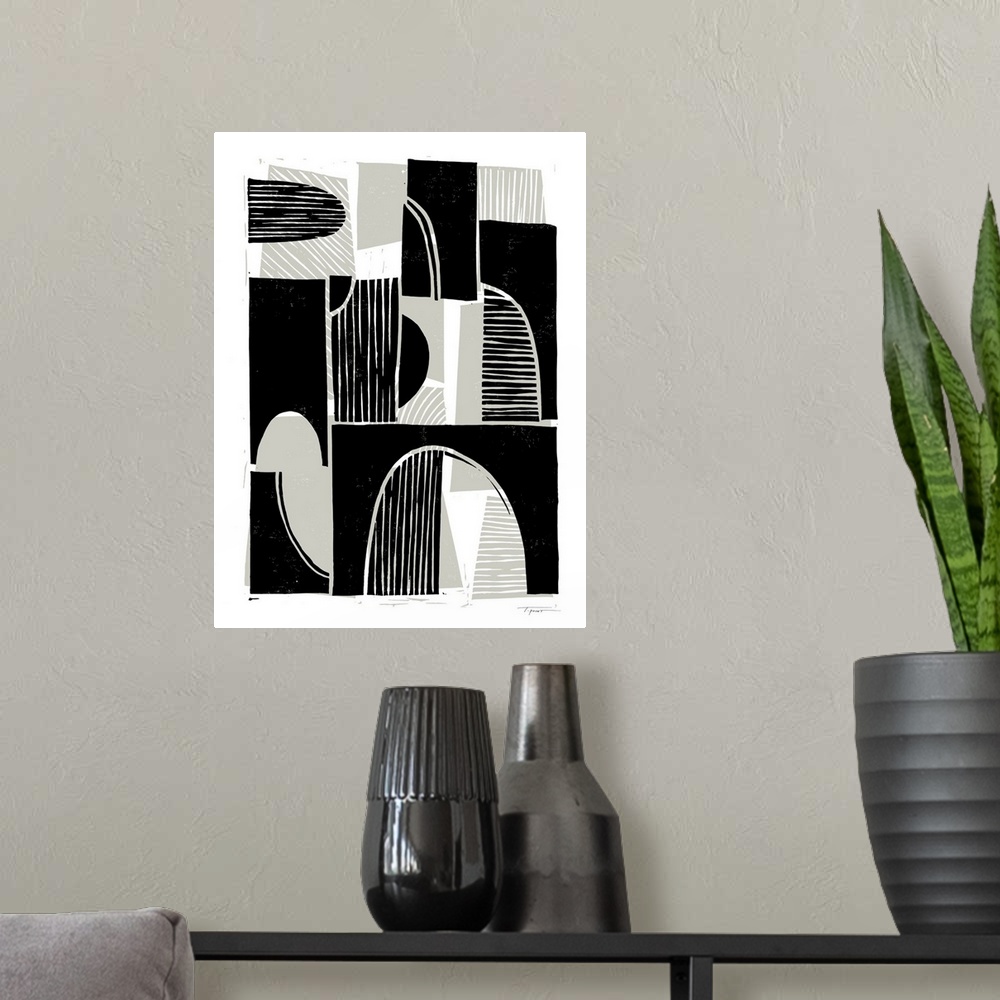 A modern room featuring Modern abstract block print with taupe background shapes and black foreground shapes.