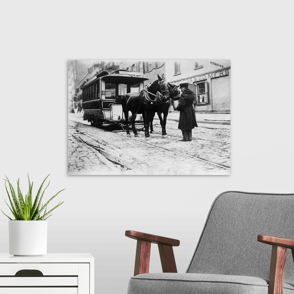 A modern room featuring A horse-drawn Chambers Street Ferry streetcar in downtown Manhattan, New York City. Photograph, c...