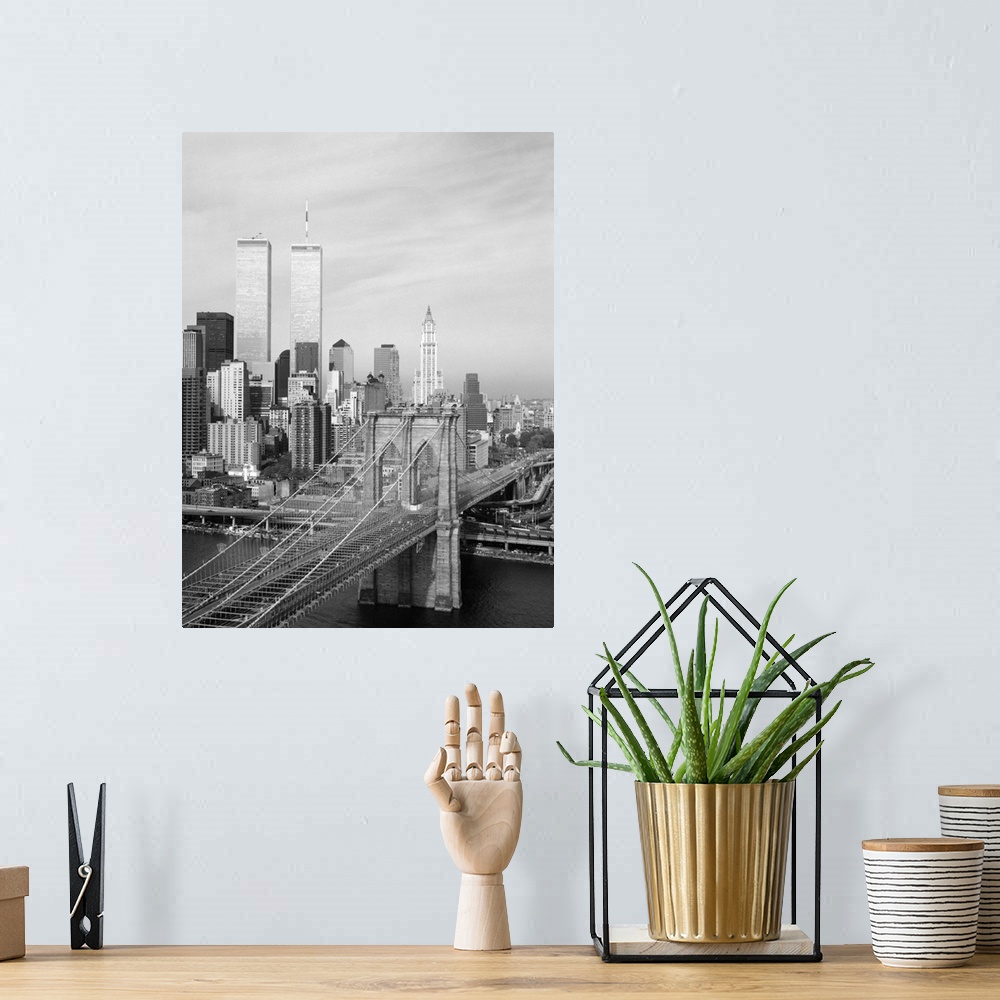 A bohemian room featuring A view of the Brooklyn Bridge looking west towards Manhattan, New York. Photograph by Jet Lowe, 1...
