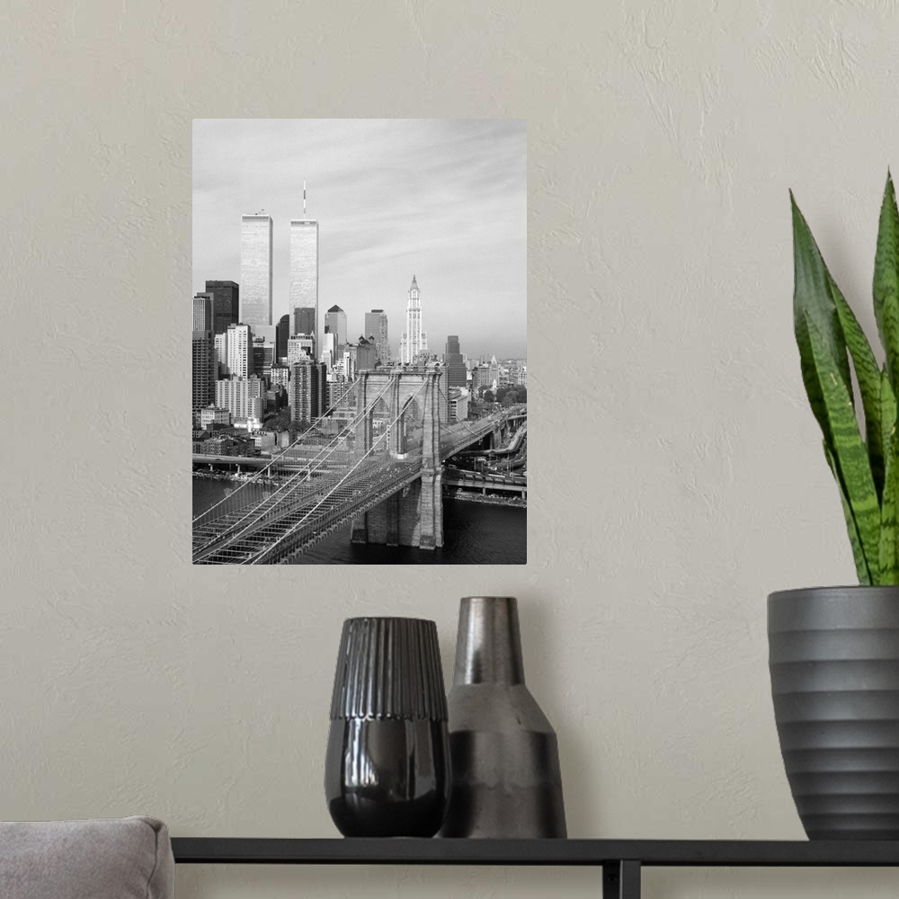 A modern room featuring A view of the Brooklyn Bridge looking west towards Manhattan, New York. Photograph by Jet Lowe, 1...