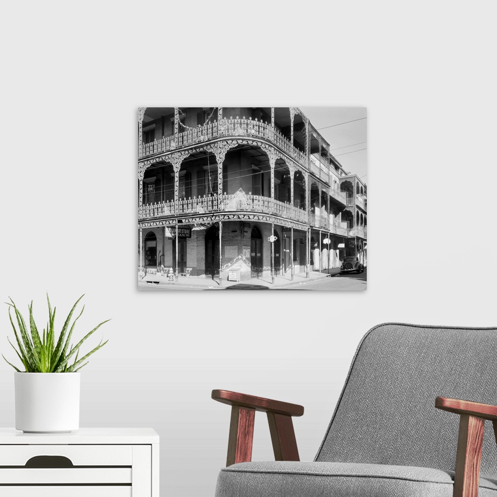 A modern room featuring A view of the cast-iron lacework balconies of the LaBranche house on the corner of Royal and St. ...