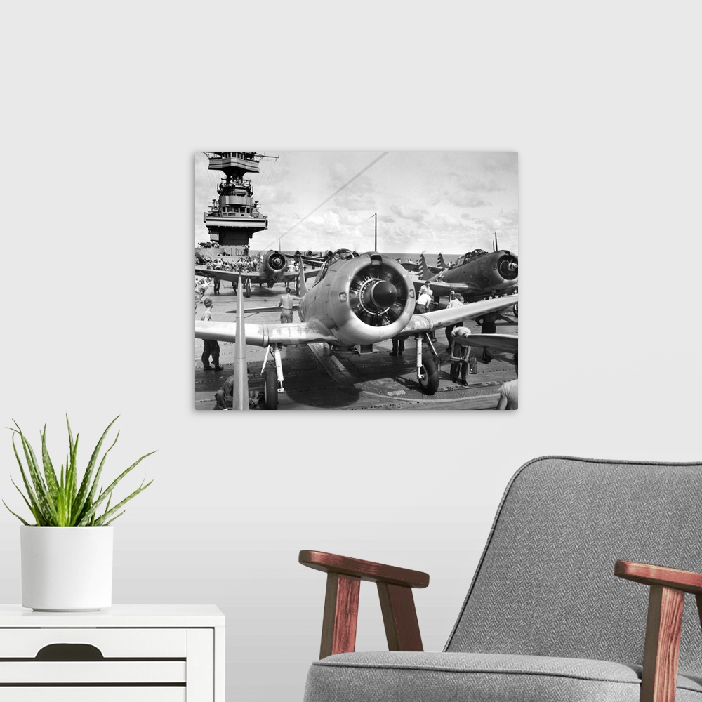 A modern room featuring Flight deck of an American aircraft carrier during World War II. Photograph, 1942.