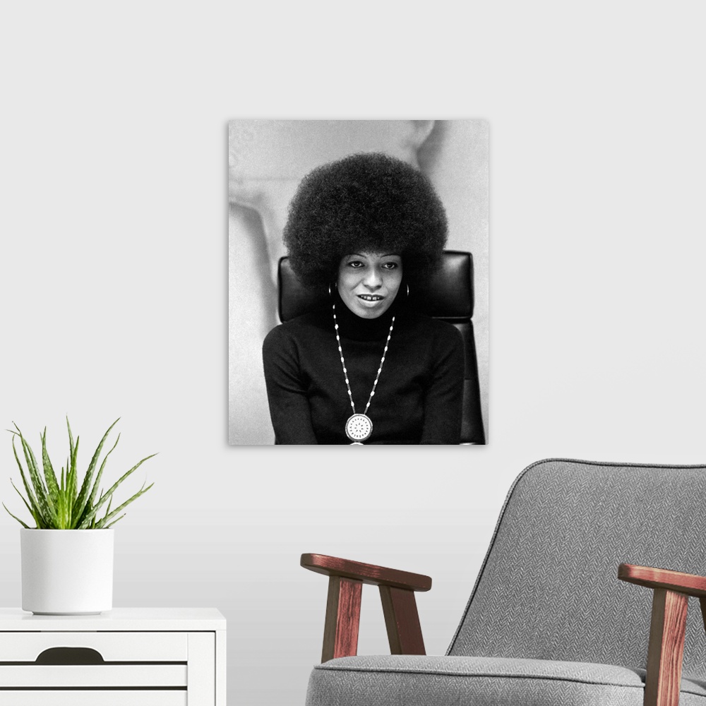 A modern room featuring ANGELA DAVIS (1944- ). American political activist. Photograph by Bernard Gotfryd, 1974.